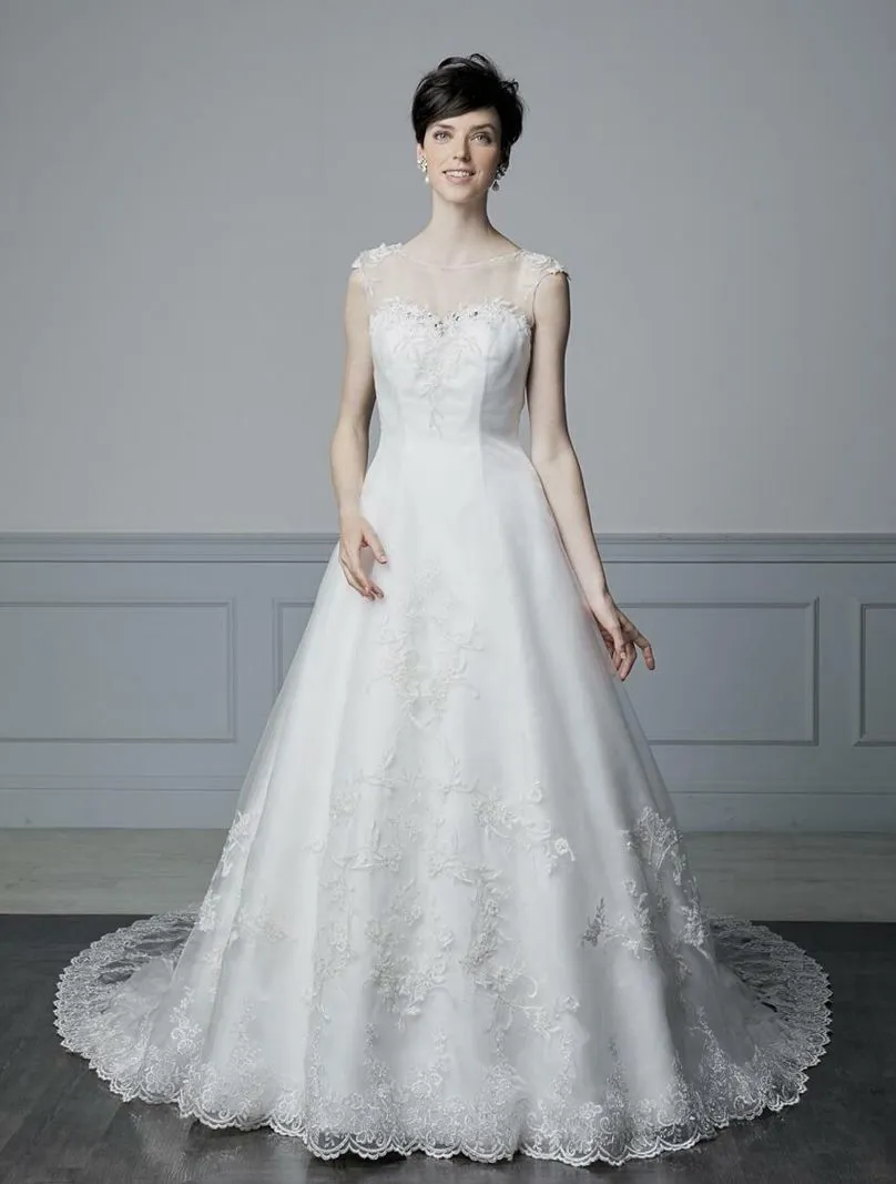 ---Elegant wedding dress with sheer bodice for a super sensual look made of satin and tulle with lace appliques and sparkling st