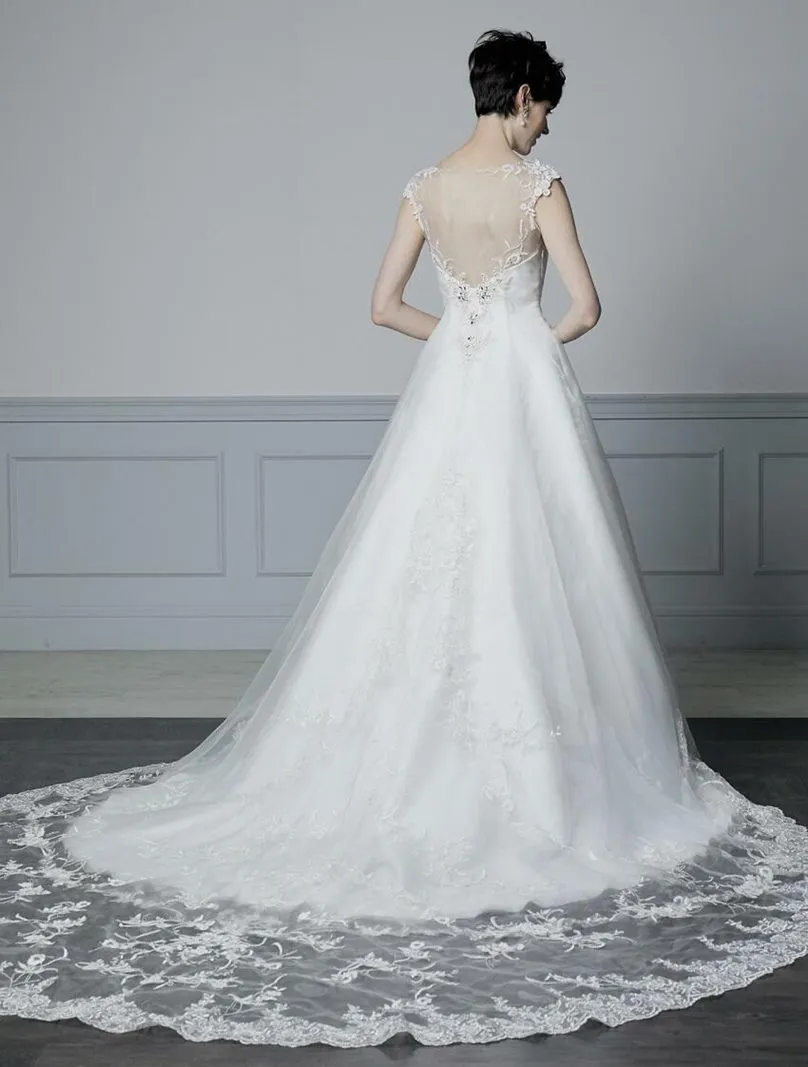 ---Elegant wedding dress with sheer bodice for a super sensual look made of satin and tulle with lace appliques and sparkling st