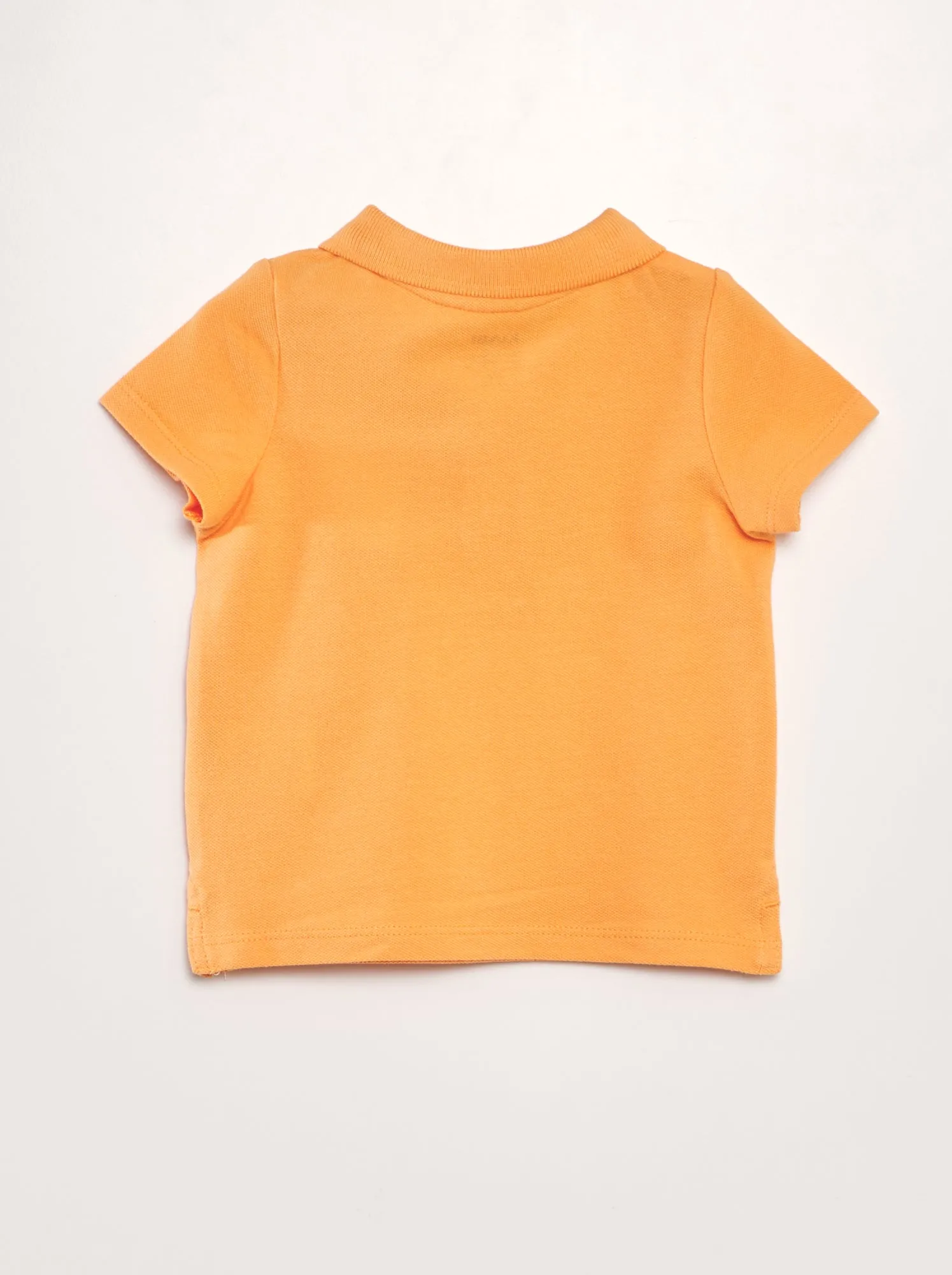 Polo in piqué di cotone 'palme' - ARANCIONE