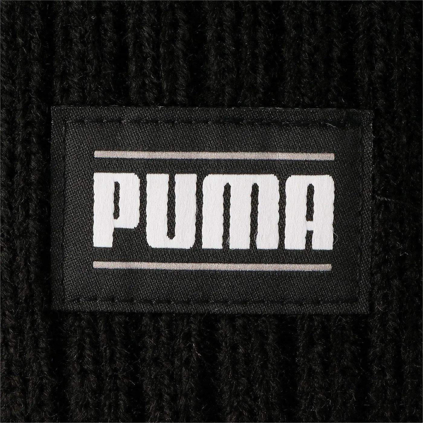 Puma ribbed beanie hat with petch logo 024038-01 black. One size